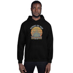 Person wearing a black hoodie with a graphic design on a white background