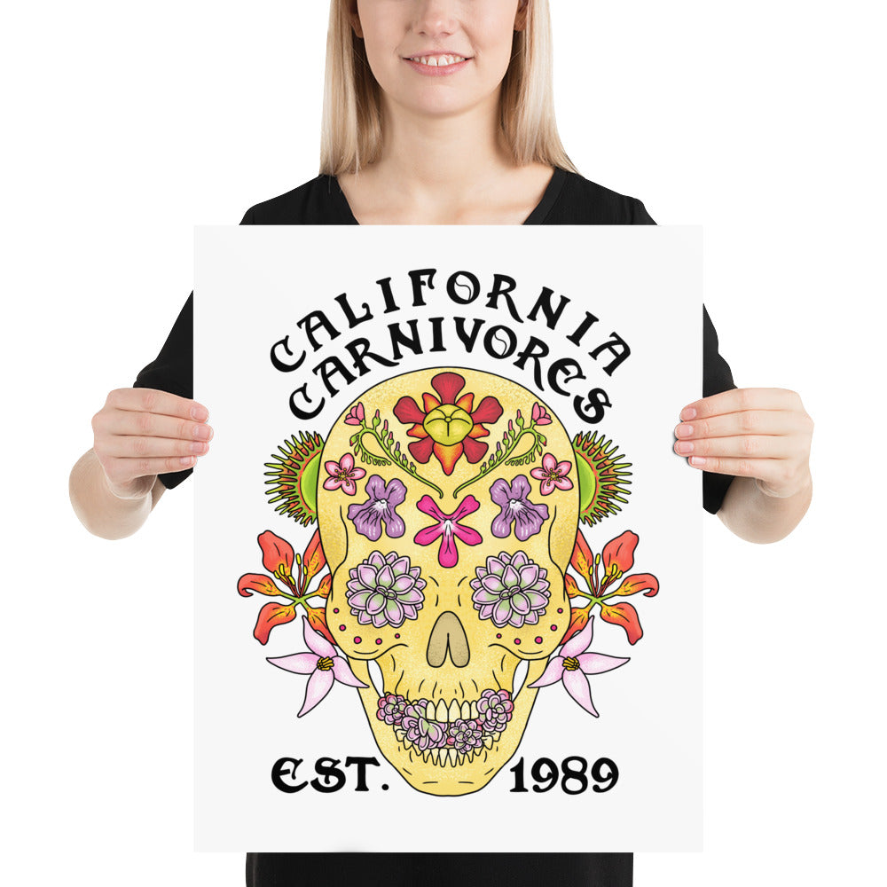 Person holding a poster with a colorful skull design and 'California Carnivores' text.