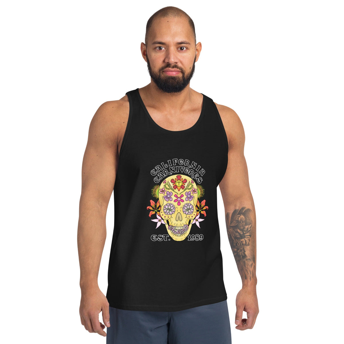 Man wearing a black tank top with a mushroom graphic and text on a white background