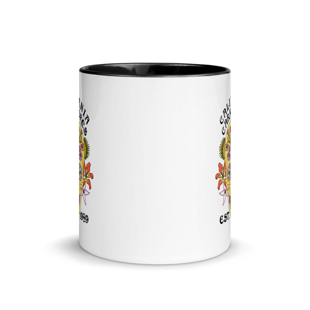 White mug with black interior and yellow text on a white background