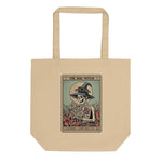 Beige tote bag with a graphic of a skeleton wearing a witch hat and holding a book, labeled 'The Bog Witch'.