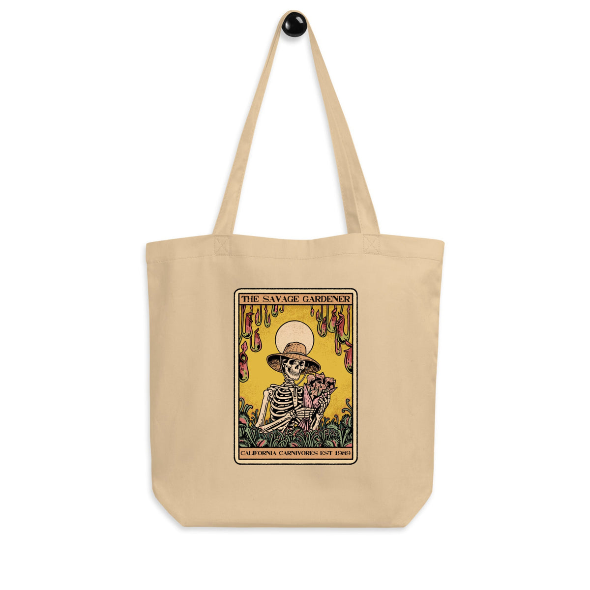 Beige tote bag with a graphic design featuring a skeleton and text on a white background