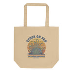 Beige tote bag with 'Stuck on You' graphic design on a white background