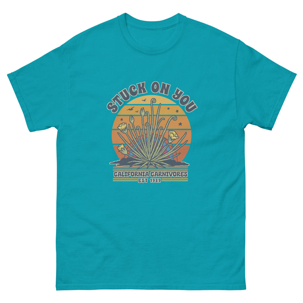 tropical blue t-shirt with graphic design and text on a white background