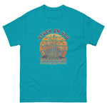 tropical blue t-shirt with graphic design and text on a white background
