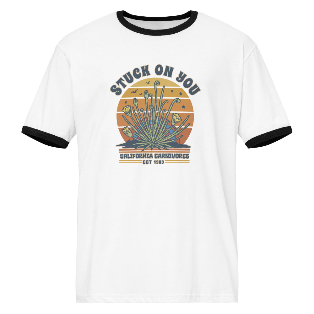 White t-shirt with black ringer sleeves featuring a graphic design on a white background