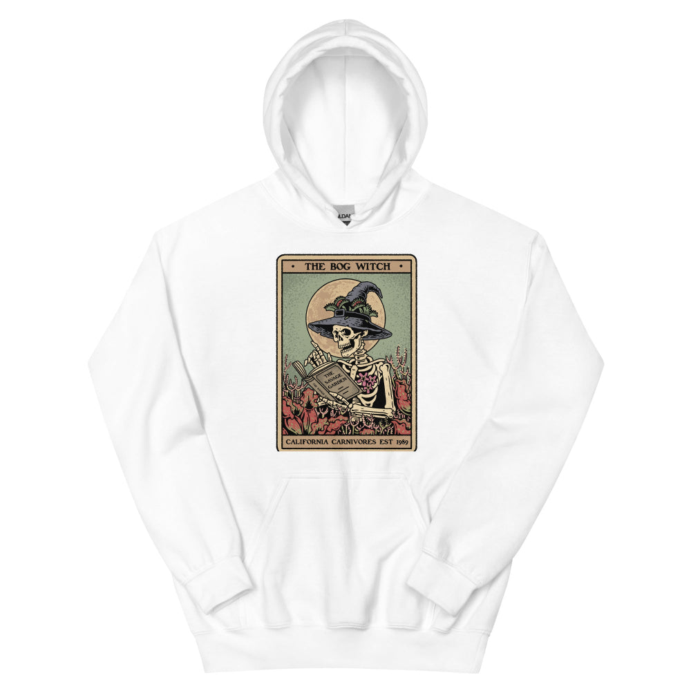 White hoodie with a graphic of a skeleton in a witch hat and books on a white background
