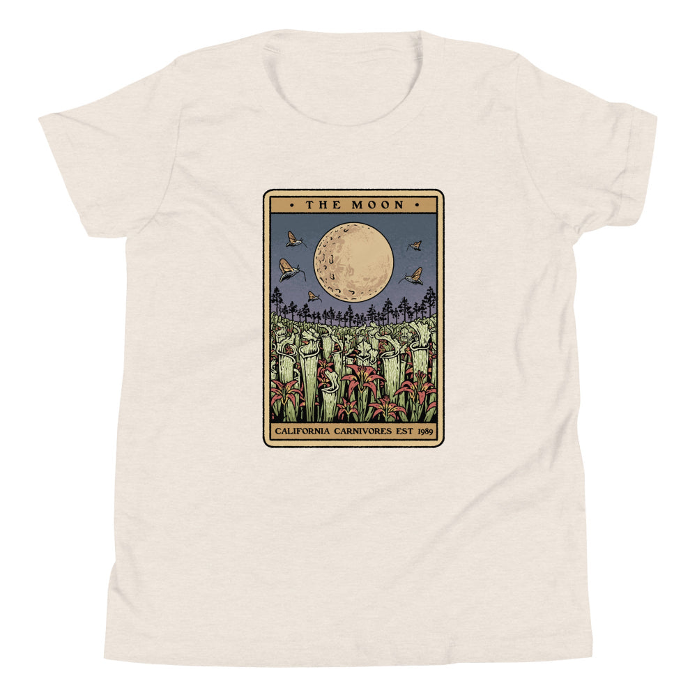 Beige t-shirt with 'The Moon' tarot card design on a white background