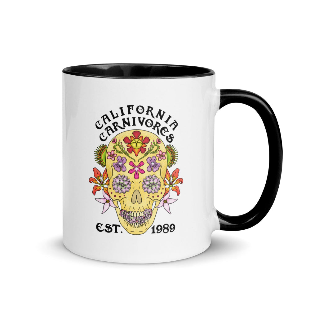 Mug with floral skull design and 'California Carnivores' text on a white background