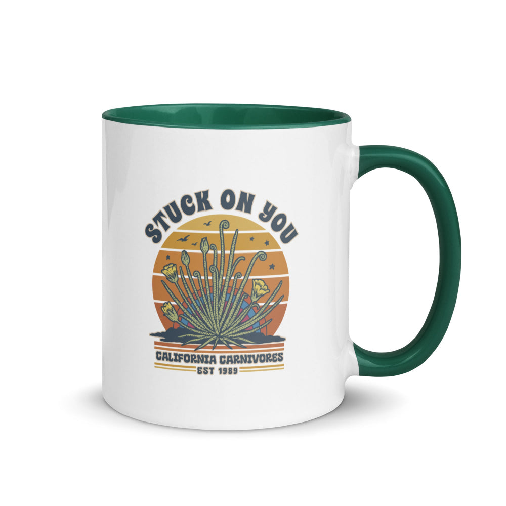 Mug with a graphic design of a plant and text on a white background