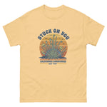 Yellow t-shirt with graphic design and text on a white background