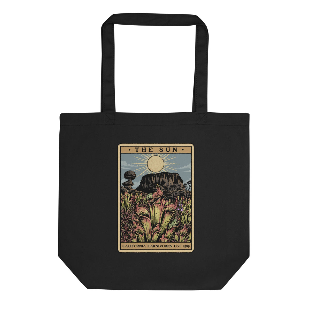 Black tote bag with a tarot card-style design featuring plants and 'The Sun' card text.